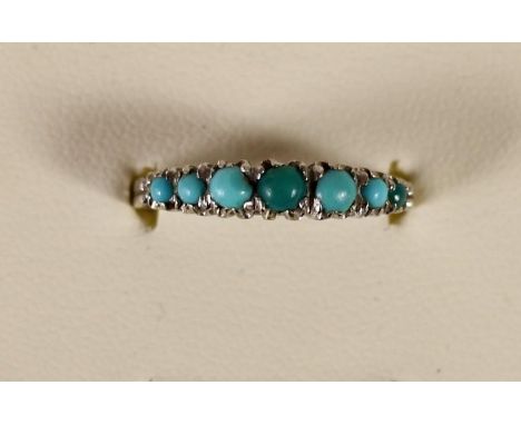 An 18ct white gold seven stone turquoise ring, 2.3, P. 