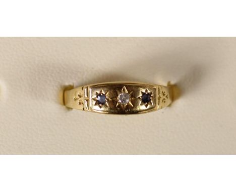 An Edwardian 18ct gold sapphire and diamond three stone ring, 1.6gm, R 