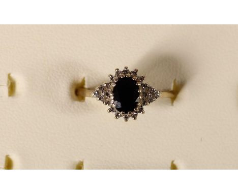A 9ct gold sapphire and diamond cluster ring, 2.6gm, R 