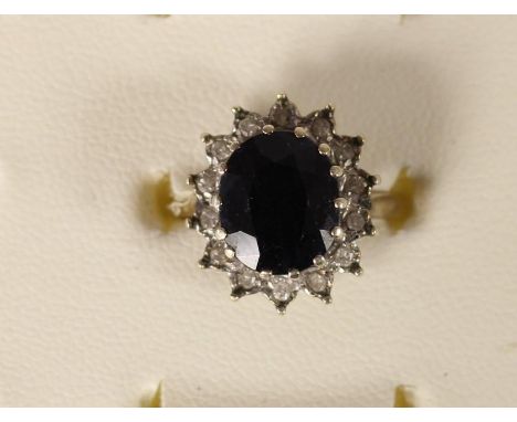 A 9ct gold sapphire and diamond cluster ring, 3.8gm, L 1/2. 