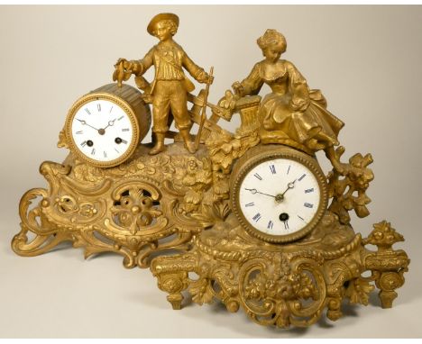 A 19th century French gilt metal, figural mantel clock, surmounted by a hunter, height 32 cm, pendulum, together with a simil