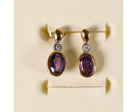 A pair of 9K amethyst and diamond ear studs, 1.3gm