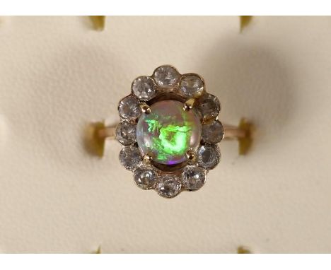 An unmarked rose gold opal and paste cluster ring, 2.8gm, N 