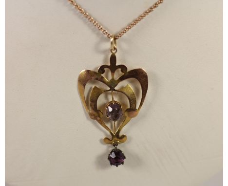 An Edwardian 9ct rose gold and amethyst openwork pendant, stamped 9ct, chain, 3.8gm