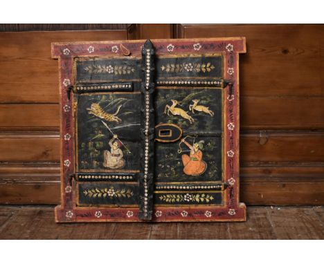 A pair of small antique Indian doors within frame with hand painted decoration depicting hunting scenes. H.54 W.50cm 