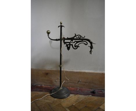 A vintage adjustable wrought iron desk lamp with scrolling foliate detail. H.67 W.30cm 