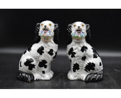 A pair of late 19th century ceramic Staffordshire dogs. H.22 W.12cm (2) 