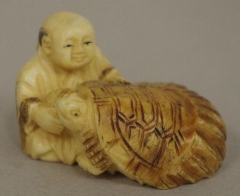 Antique Japanese ivory seated man & turtle netsuke red seal signed to base, May not be exported without CITES documentation.W
