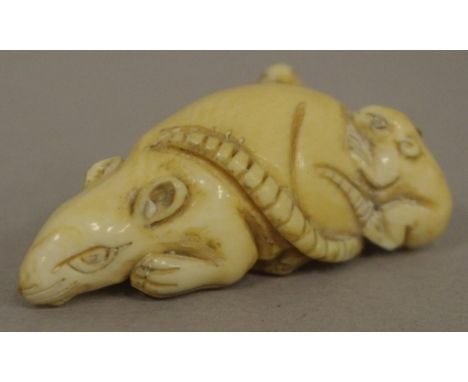 Antique Japanese rat with young ivory netsuke C1920. Signed to base. May not be exported without CITES documentation. L4.5cms