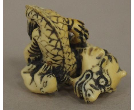 Antique Japanese dragon & young ivory netsuke C1920. May not be exported without CITES documentation. H2.5cms approx.