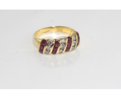 18ct channel set ruby and diamond ring designed by Robert Cliff, weight: approx 5.2 grams, size: O-P/7,  (valuation available