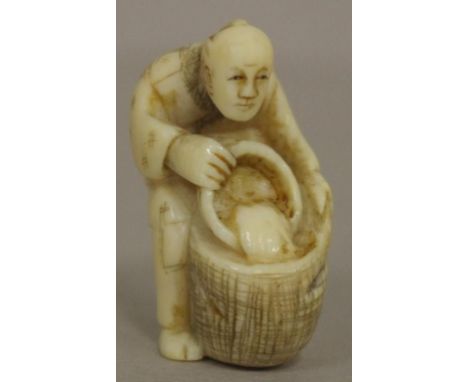 Antique Japanese man with bucket ivory netsuke C1920. Signed verso. May not be exported without CITES documentation. H4cms ap