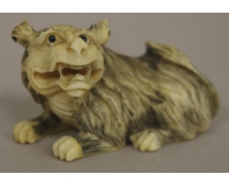 Antique Japanese mythical dog ivory netsuke C1920. Signed to base. May not be exported without CITES documentation. H3cms app