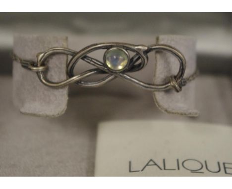 Boxed Lalique Ronces bracelet with central crystal on silver chain. Original box and descriptive leaflet available.