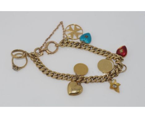 Late Victorian yellow gold charm bracelet with bolt clasp, assorted charms added later mostly 9ct including enamel hearts wit