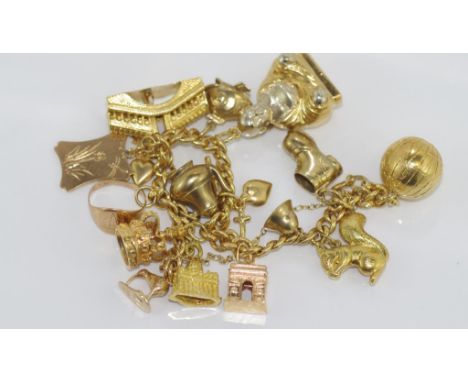 18ct yellow gold bracelet with world charms total weight: approx 54.7 grams, charms marked 9ct, 14K and 750, many unmarked (t