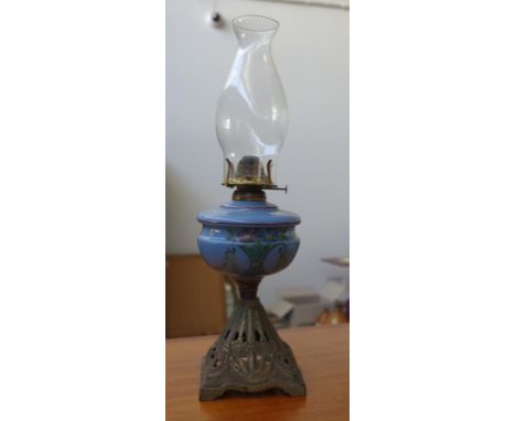 Antique American oil lamp with hand painted glass reservoir and cast metal base, 50cm high