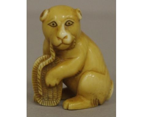 Antique Japanese sitting dog ivory netsuke C1920. Signed to base. May not be exported without CITES documentation.H4.5cms app