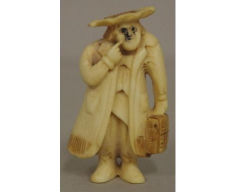 Antique Japanese travelling man ivory netsuke C1920. Signed to base. May not be exported without CITES documentation. H5cms a
