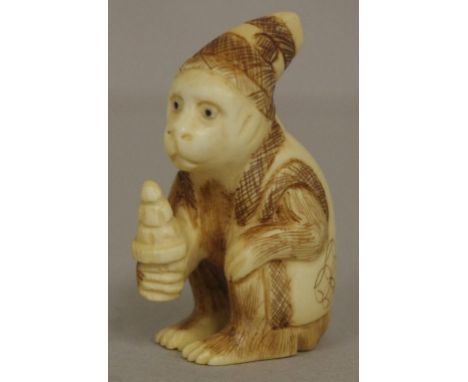 Antique Japanese ivory seated monkey netsuke signed to base, May not be exported without CITES documentation.H5.5cm approx