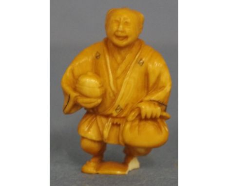 Antique Japanese standing man ivory netsuke C1920. Signed to base. May not be exported without CITES documentation. (As inspe
