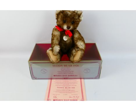 Steiff - A boxed Limited Edition Steiff replica 1926 Teddy Bear. The bear which stands 40cms in height, comes with Steiff but