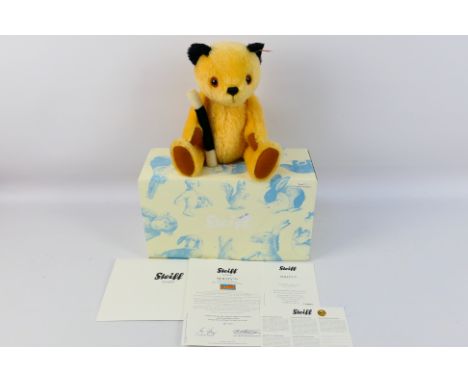 Steiff - A boxed Limited Edition Steiff 'Sooty' Bear. The bear which stands 30cms in height, comes with Steiff button and whi