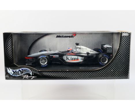 Hot Wheels - A boxed 1:18 scale Hot Wheels 'Racing' JB1650 McLaren MP4-17D F1 diecast racing car, 'Kimi Raikkonen'. The model