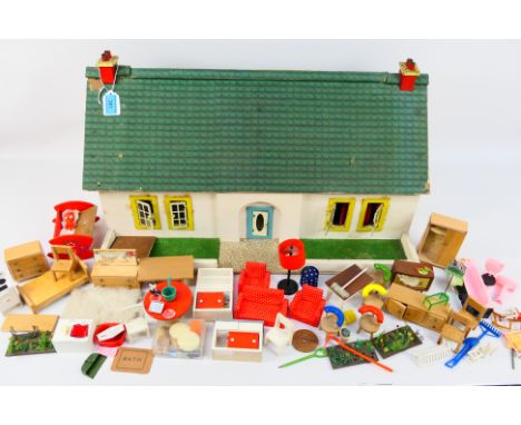 Unmarked Maker - A vintage Dolls 'Bungalow' with a large quantity of doll furniture and accessories. The bungalow (similar in