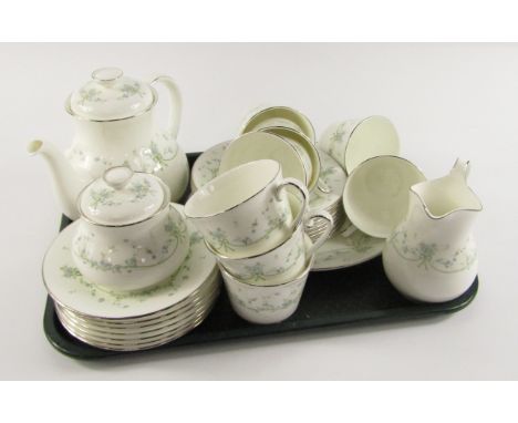 A Royal Doulton porcelain part tea service, decorated in the Demure pattern comprising teapot, cream jug, sucrier, bread plat