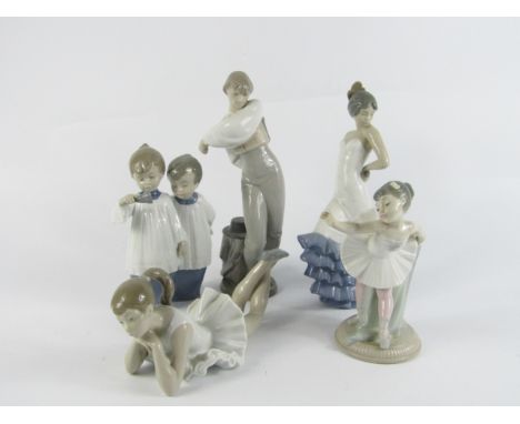 Five Lladro Nao porcelain figures, comprising of a Flamenco girl dancer, girl ballerina standing, another recumbent, pair of 