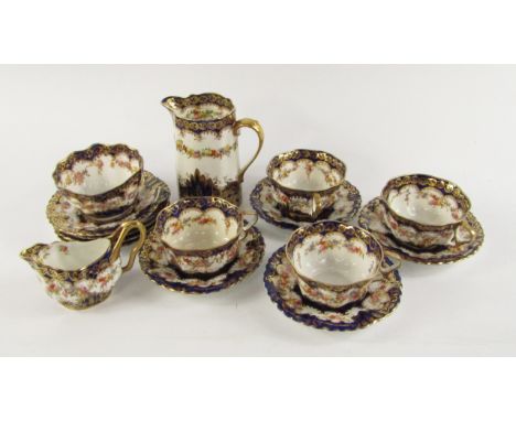 A Staffordshire porcelain late 19thC part tea service, of fluted form decorated with flowers against a cobalt blue ground, gi