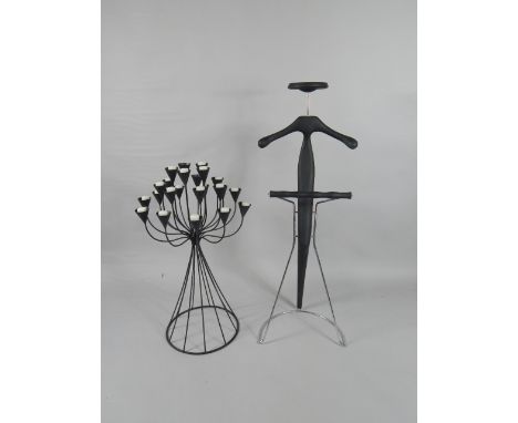 A black metal twenty three branch tea light candelabra, 91cm high, and a clothes tree, (2).