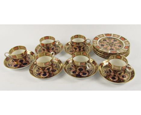 A set of six Royal Crown Derby Olde Imari tea cups, saucers, and plates, pattern 1128, printed marks.