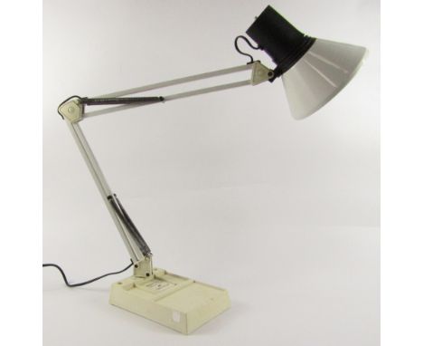 A mid 20thC white anglepoise table lamp, on a cream plastic coated cast iron base, 85cm high