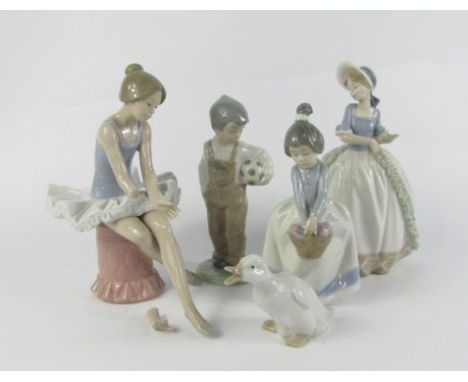 Five Lladro Nao figures, comprising of a seated ballerina, girl with flowers, boy with a football, girl in a crinoline dress 