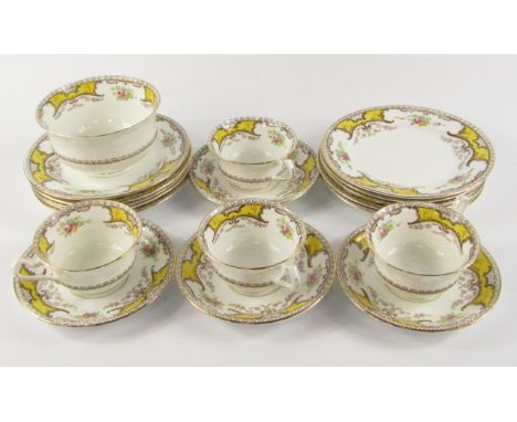 A Staffordshire porcelain part tea service, decorated in the Kenmare pattern, comprising sugar bowl, four cups and saucers an