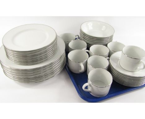 A Royal Worcester porcelain part dinner and coffee service, decorated in the classic Platinum pattern, comprising eight dinne