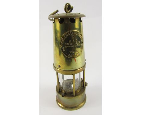 A brass miner's safety lamp, type 6, M & Q, by The Protector Lamp & Lighting Co Ltd., 25cm high