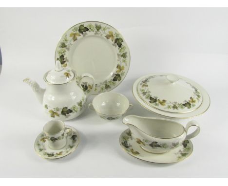 A Royal Doulton porcelain part dinner and coffee service, decorated in the Larchmont pattern, comprising of a pair of tureens