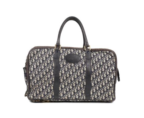 Christian Dior: a Blue Oblique Travel Bag1970sBlue logo canvas with dark blue leather trim and gold hardwareCondition Grade C