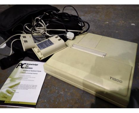 Vintage Toshiba T1200 system unit model no PA7048UK, complete with power pack, leads, two battery packs, and Toshiba carry ca