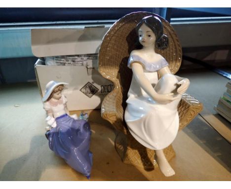 Two boxed Nao figurines and a  ceramic girl on a chair. Not available for in-house P&amp;P 