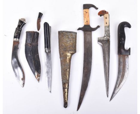 Pathan Dagger Chora from the North West Frontier, in its brass sheath; a N. African dagger with inscribed curved single edge 