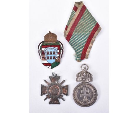 Hungarian Silver Merit Medal, “Signum Laudis 1922” with crown fitting; 1942 Hungarian merit cross and enamel pin back badge. 