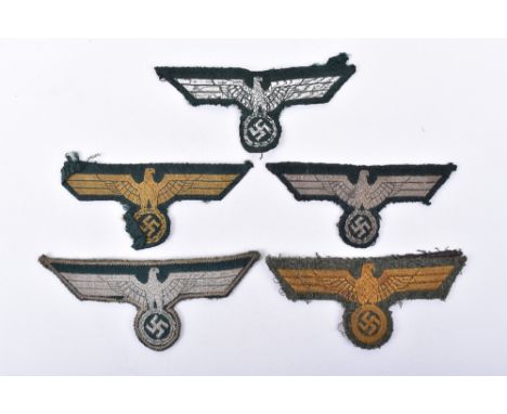 Grouping of Tunic Breast Eagles, consisting of German army NCO’s combat tunic example in silver wire thread, M-36 pattern com