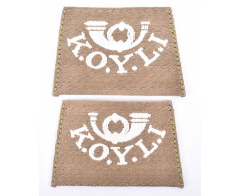 Pair of WW1 Kings Own Yorkshire Light Infantry Slip-on Shoulder Titles, facing pair of machine woven white on khaki French ho