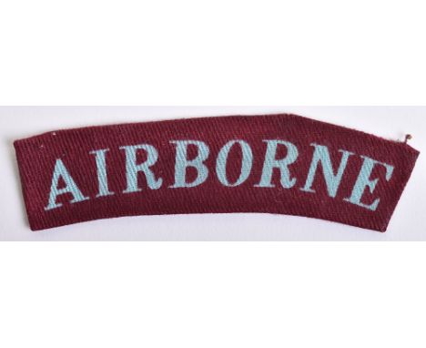 Printed Airborne Shoulder Title, uniform removed example of the curved printed Airborne title with light blue lettering on ma