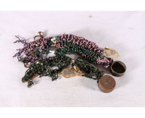 Two late 19th century Zulu beaded wedding necklaces, one with attached Victorian tin snuff box, the other similar, the second