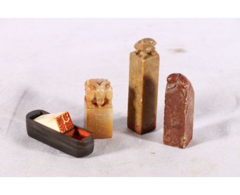 Chinese carved ivory seal with wooden box base, 3cm, a well carved soapstone seal with mythical beast above, 4cm and two furt